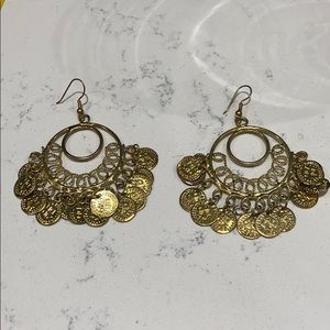 Gold toned coin chandelier earrings.